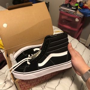 Black and white Vans (high top)